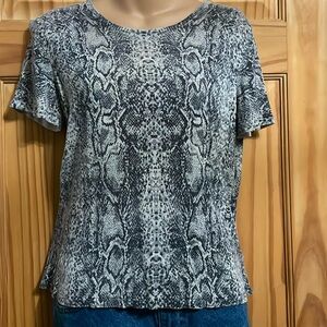 Women’s light weight short sleeved silk sweater. Cardigan sold separately.